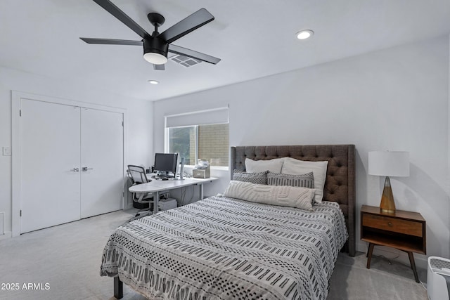 bedroom featuring ceiling fan, recessed lighting, light colored carpet, visible vents, and a closet