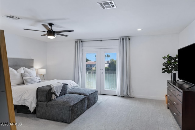 bedroom with light carpet, access to outside, visible vents, and french doors