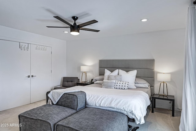 bedroom with ceiling fan, light colored carpet, and recessed lighting