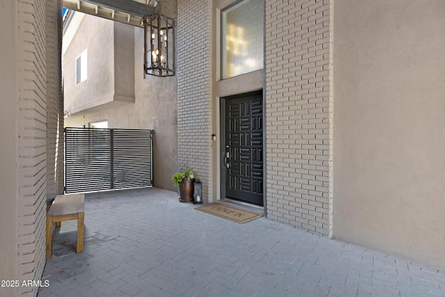 property entrance featuring stucco siding