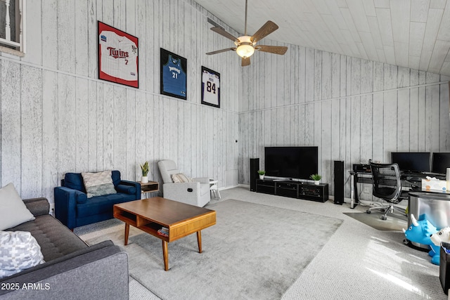 carpeted living room with high vaulted ceiling and ceiling fan