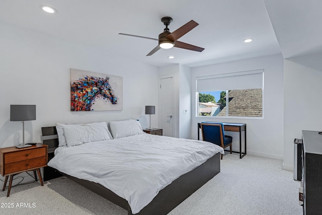 bedroom featuring a ceiling fan, recessed lighting, light colored carpet, and baseboards