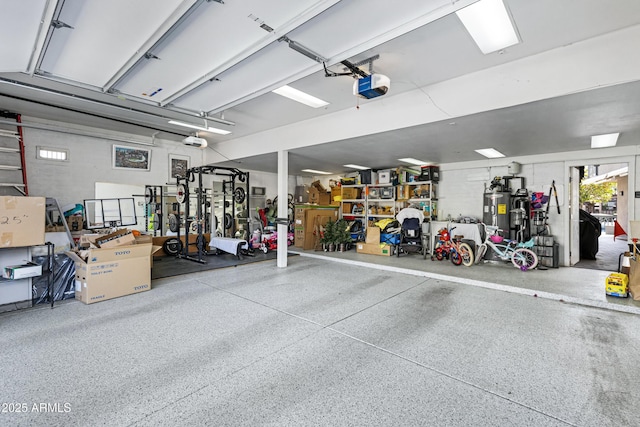 garage with a garage door opener and water heater