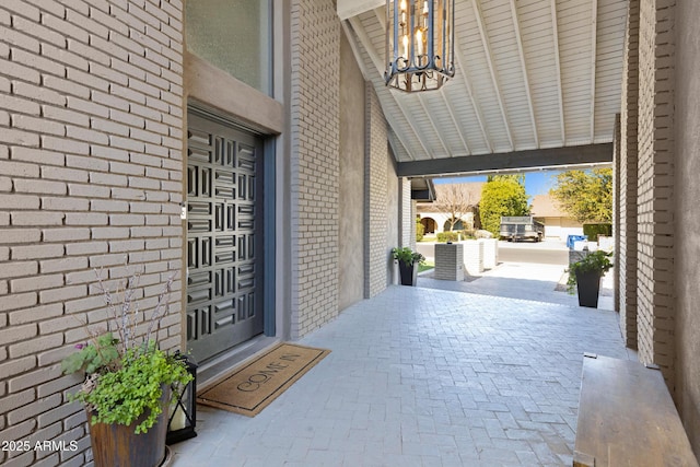 entrance to property with brick siding