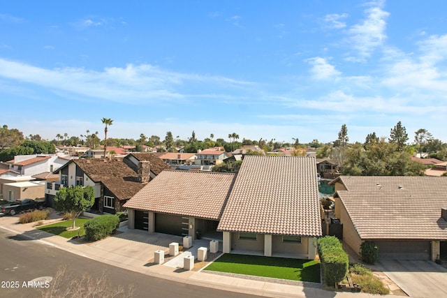 birds eye view of property with a residential view