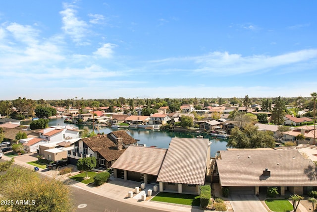 birds eye view of property featuring a residential view and a water view