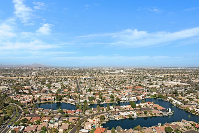 birds eye view of property with a water view and a residential view