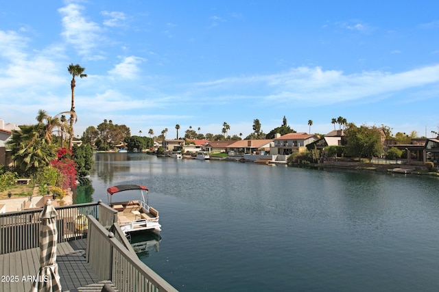 view of water feature with a dock and a residential view