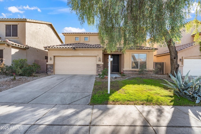 mediterranean / spanish-style home with a front yard and a garage