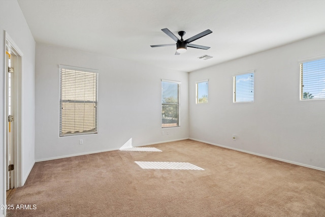 unfurnished room featuring ceiling fan and light colored carpet