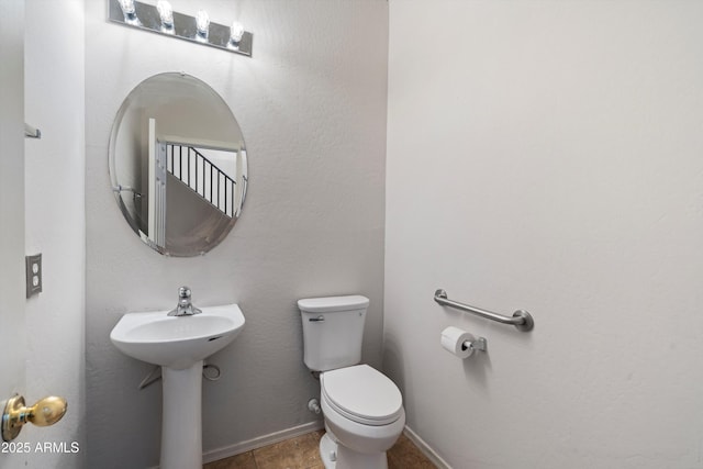 bathroom with sink and toilet