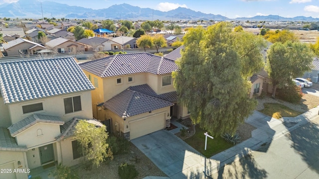 birds eye view of property featuring a mountain view