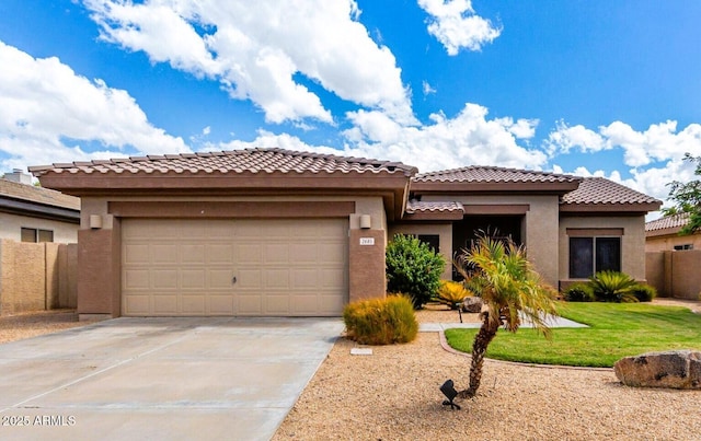 2685 N 132nd Dr, Goodyear, AZ 85395 - mediterranean / spanish house with concrete driveway, a garage, a tiled roof, and stucco siding