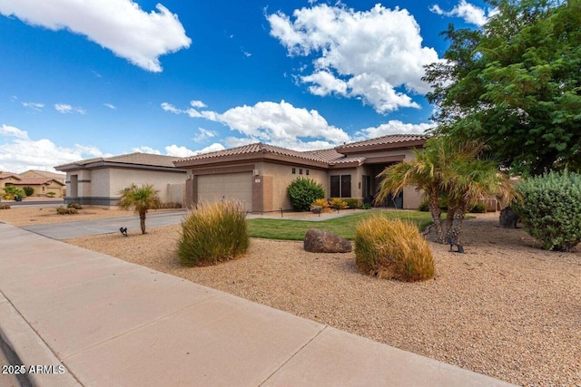2685 N 132nd Dr, Goodyear, AZ 85395 - view of front of property featuring stucco siding, an attached garage, a tile roof, and driveway