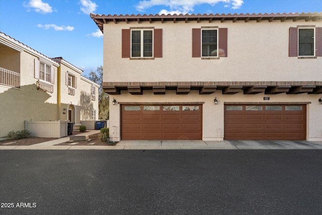 mediterranean / spanish-style home featuring a garage