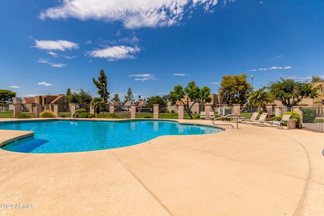 view of swimming pool featuring a patio