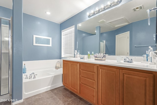 bathroom featuring vanity, tile patterned flooring, and separate shower and tub