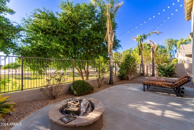 view of patio featuring an outdoor fire pit