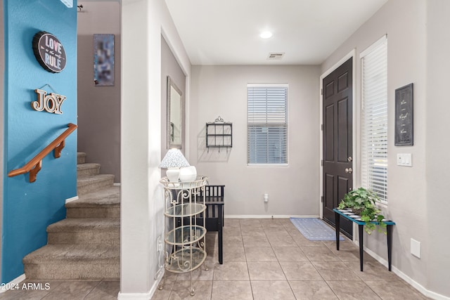 entryway with tile patterned floors