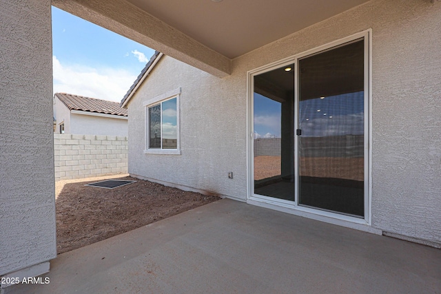 view of patio / terrace with fence