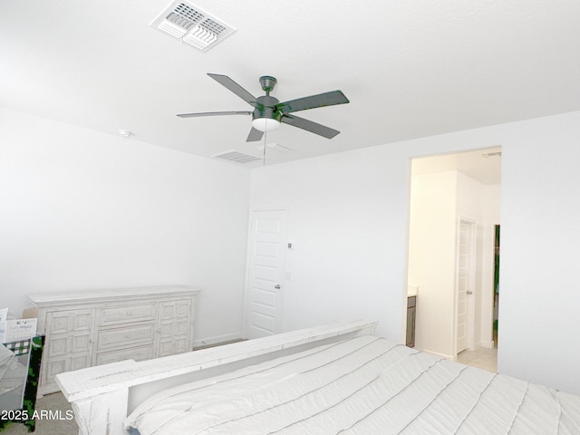 bedroom with visible vents, ceiling fan, and ensuite bath