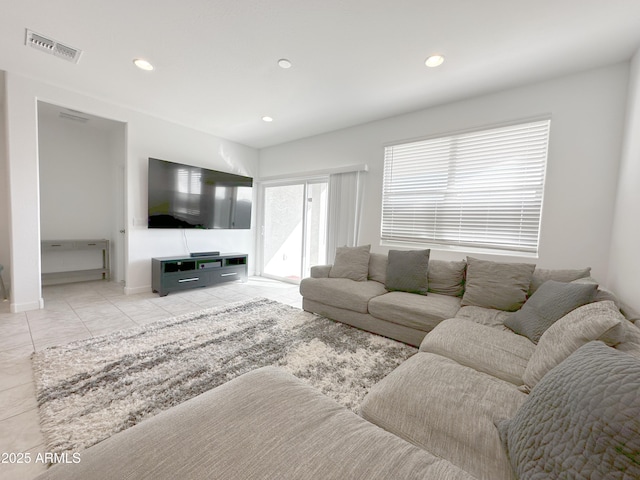 tiled living room featuring recessed lighting and visible vents