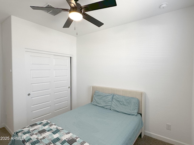 bedroom with ceiling fan, a closet, carpet flooring, and baseboards