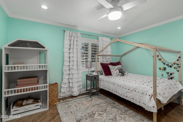 bedroom with crown molding, wood finished floors, ceiling fan, and recessed lighting