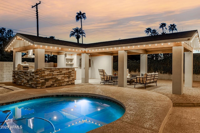 view of pool featuring area for grilling, outdoor lounge area, and a patio