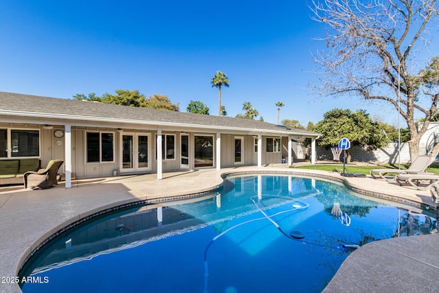 view of pool with a patio, fence, a fenced in pool, and a ceiling fan