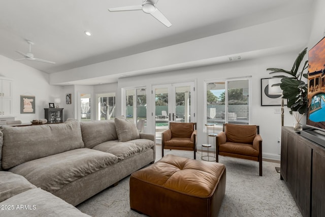 living area featuring baseboards, recessed lighting, french doors, and a ceiling fan