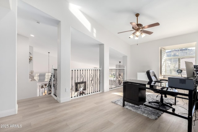 office area with ceiling fan and light hardwood / wood-style flooring