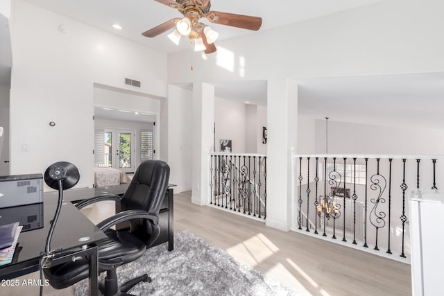 office space featuring ceiling fan and light hardwood / wood-style flooring