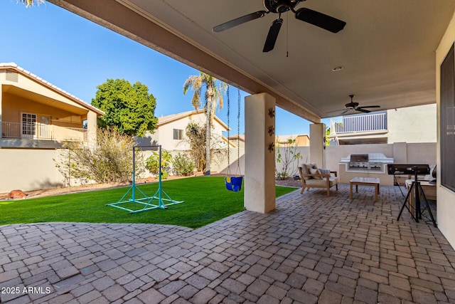 view of patio featuring area for grilling and ceiling fan