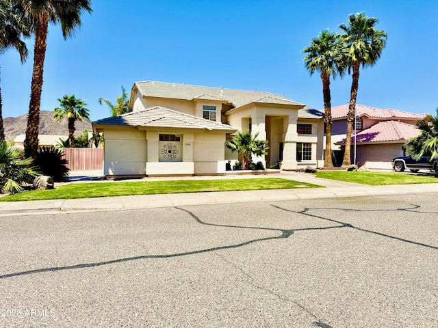 5748 W Soft Wind Dr, Glendale, AZ 85310 - view of front of house featuring fence and stucco siding