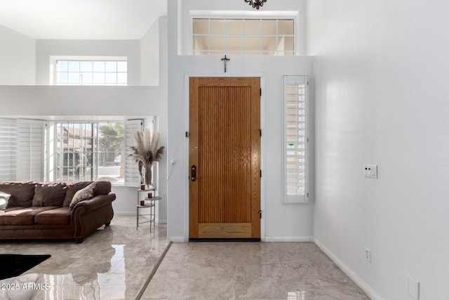 foyer entrance featuring a high ceiling