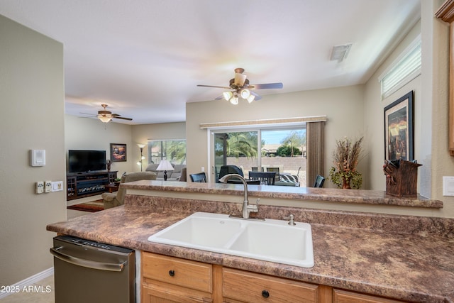 kitchen featuring sink, dishwasher, and ceiling fan