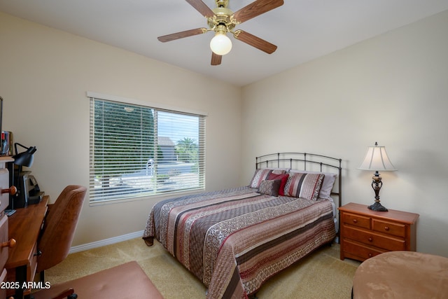 bedroom with light colored carpet and ceiling fan