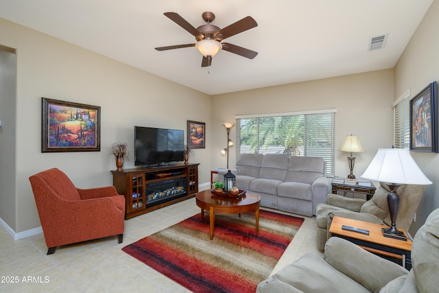 tiled living room featuring ceiling fan