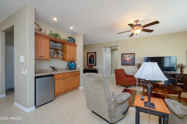 living room with ceiling fan and light tile patterned floors