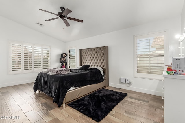 bedroom with ceiling fan and lofted ceiling