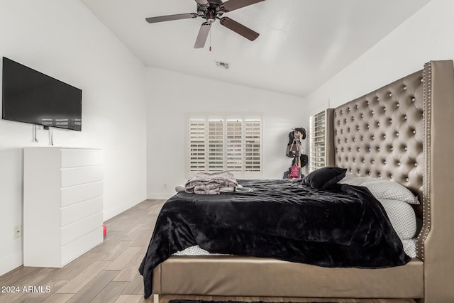 bedroom featuring ceiling fan and vaulted ceiling