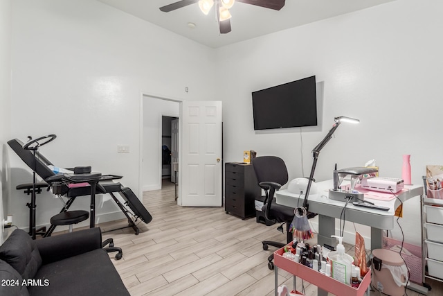 office space featuring light hardwood / wood-style flooring and ceiling fan