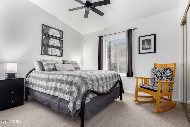 bedroom featuring lofted ceiling, ceiling fan, baseboards, and light colored carpet