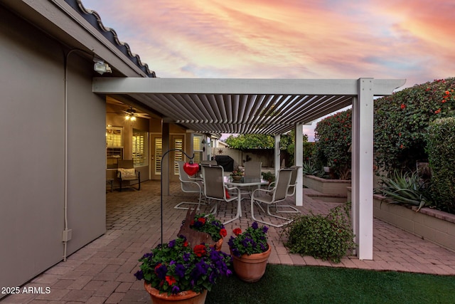 view of patio featuring outdoor dining space and fence