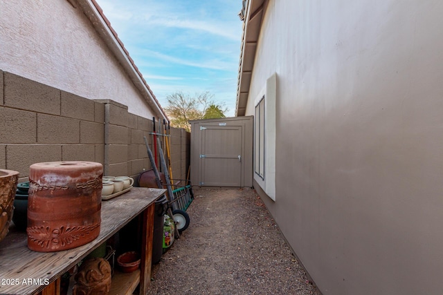 view of side of home featuring fence