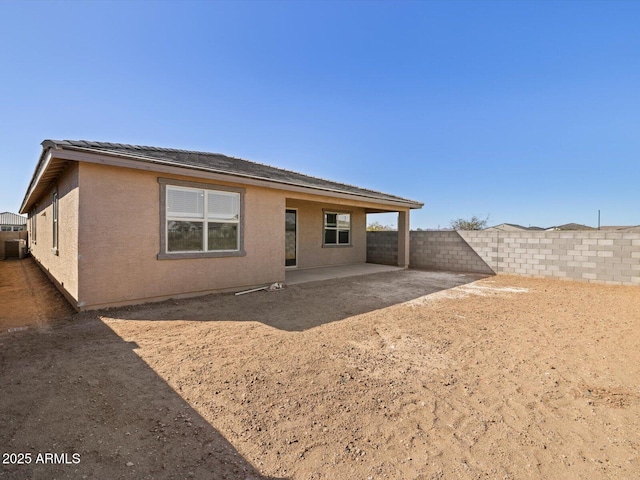 back of property featuring a patio area, a fenced backyard, and stucco siding