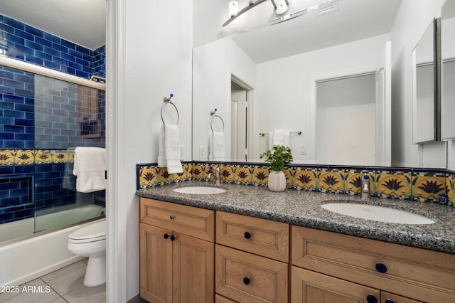 15020 N 54th Pl, Scottsdale, AZ 85254 - bathroom with double vanity, tile patterned floors, and shower / bath combination with glass door