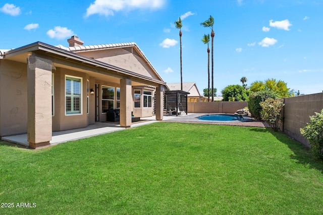 15020 N 54th Pl, Scottsdale, AZ 85254 - rear view of house with a chimney, a fenced backyard, stucco siding, and a patio