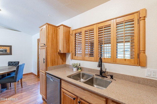 kitchen with dishwasher, light hardwood / wood-style floors, and sink